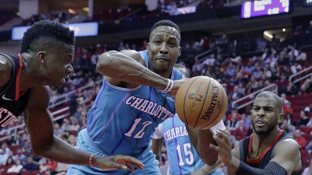 Charlotte Hornets center Dwight Howard (12) tells teammates, “stop looking like we’re defeated already.”