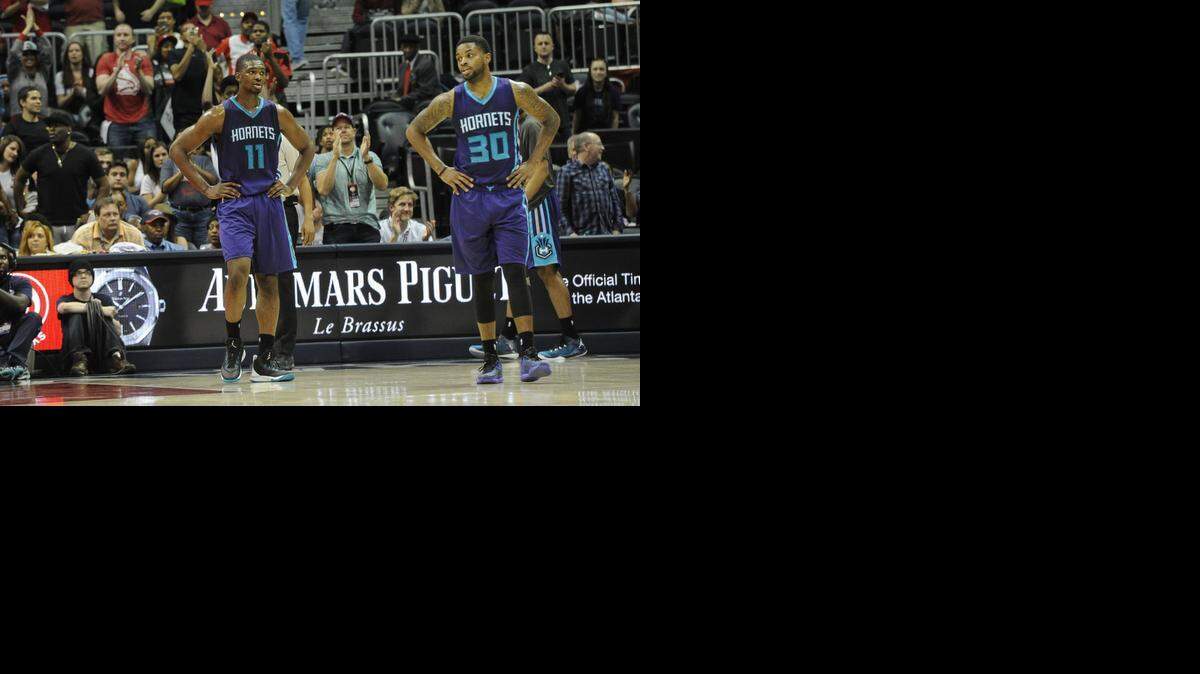 
Charlotte Hornets forward Noah Vonleh, left, and guard Troy Daniels wait for the buzzer in the final moments against the Atlanta Hawks on Friday.
