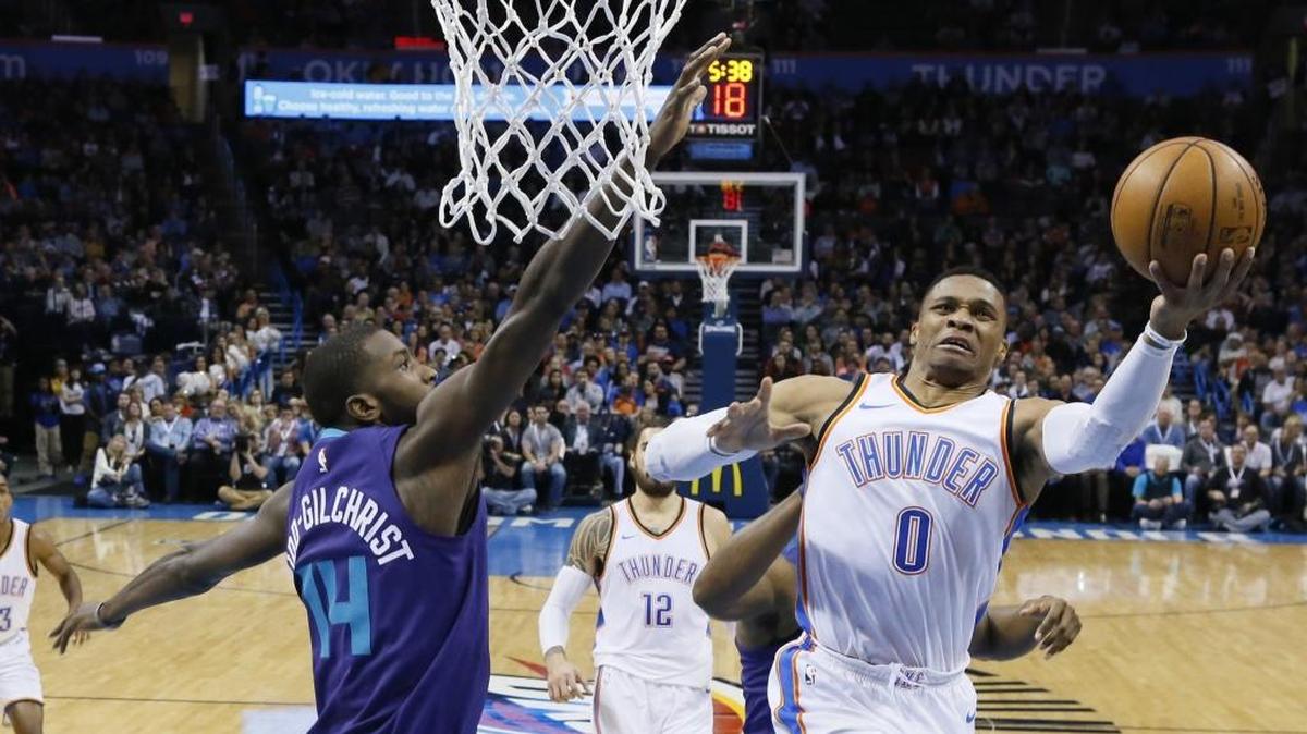 Oklahoma City Thunder guard Russell Westbrook (0) drives on Charlotte Hornets forward Michael Kidd-Gilchrist (14) in the first half Monday night.