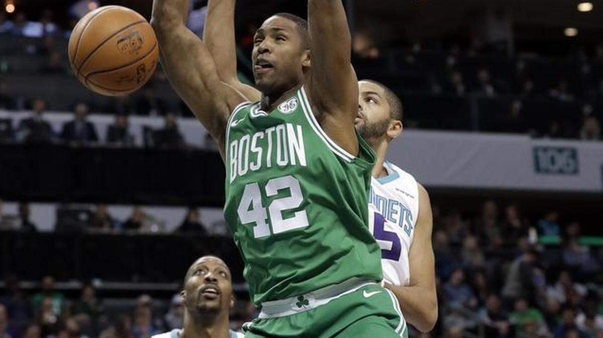 Boston Celtics power forward Al Horford (42) dunks past Charlotte Hornets guard/forward Nicolas Batum (5) during the first half of Wednesday’s game. Batum had no real impact: Seven points, three assists and three rebounds (and, granted, four steals).