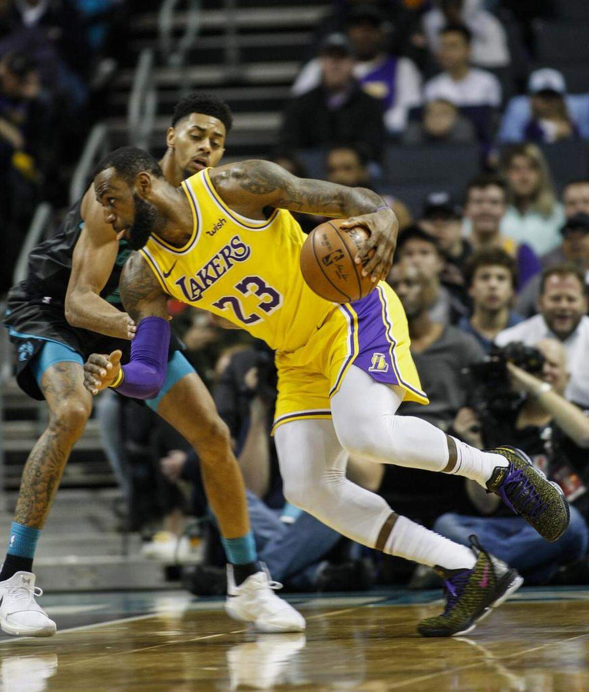 Los Angeles Lakers forward LeBron James (23) drives against Charlotte Hornets guard Jeremy Lamb in the first half of Saturday’s NBA game at Spectrum Center.