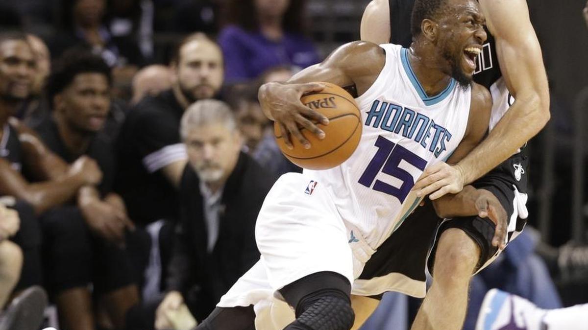 Charlotte Hornets guard Kemba Walker, front, will need to contain Boston Celtics guard Isaiah Thomas on Saturday night.