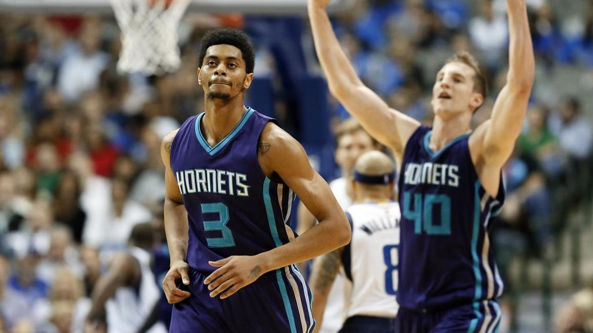 Charlotte Hornets guard Jeremy Lamb (3) runs up the court as teammate Cody Zeller (40) celebrates a 3-point basket by Lamb against the Dallas Mavericks. The Hornets won 108-94 at Dallas on Thursday.
