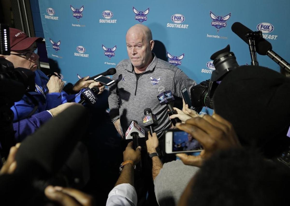Charlotte-area media surround Charlotte Hornets coach Steve Clifford on Friday at Spectrum Center, where he returned after a five-week medical leave because of debilitating headaches.