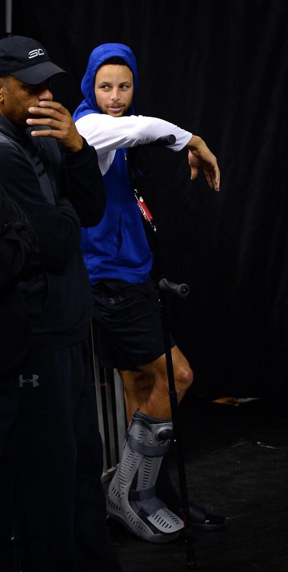 Golden State guard Stephen Curry, right, joined his father, Dell Curry, during the Warriors’ shootaround Wednesday morning at the Spectrum Center. Curry, who sprained his right ankle Monday night at New Orleans, was expected to miss Wednesday night’s game against the Charlotte Hornets.
