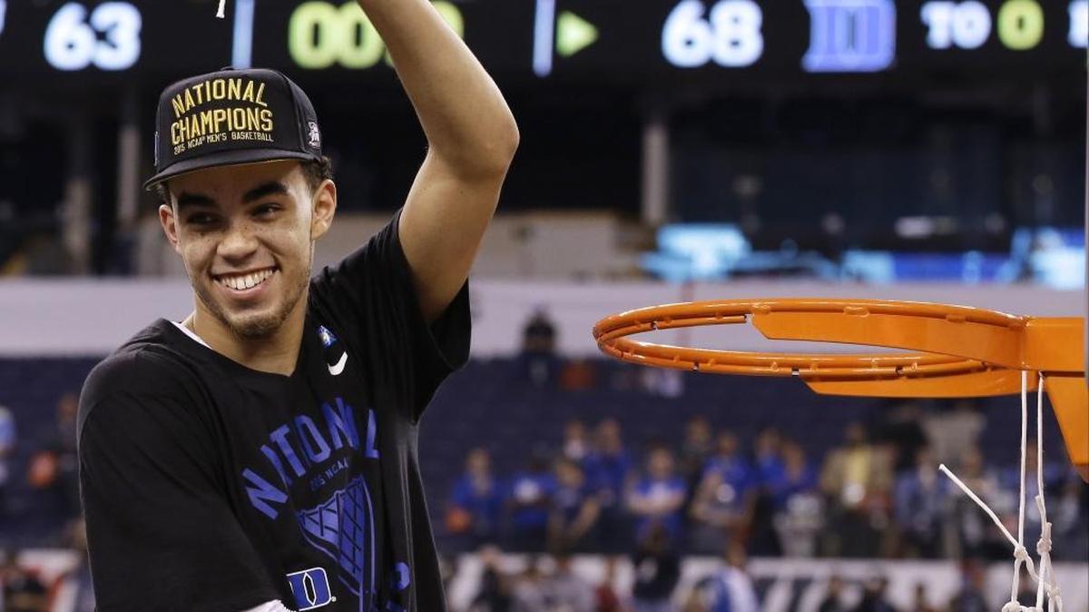 Minnesota Timberwolves guard Tyus Jones, pictured here after winning a national championship in his lone season at Duke, could be playing with the Blue Devils as a senior if he hadn’t left early for the NBA.