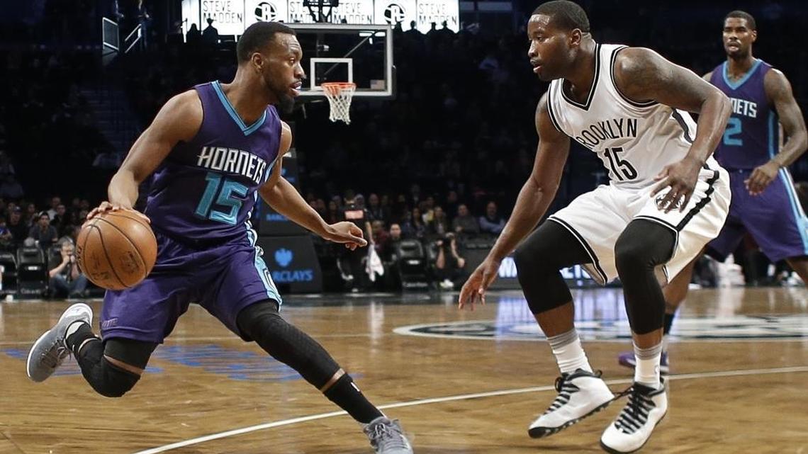 Brooklyn Nets' Donald Sloan (15) defends against Charlotte Hornets' Kemba Walker (15) during Sunday’s game in New York.
