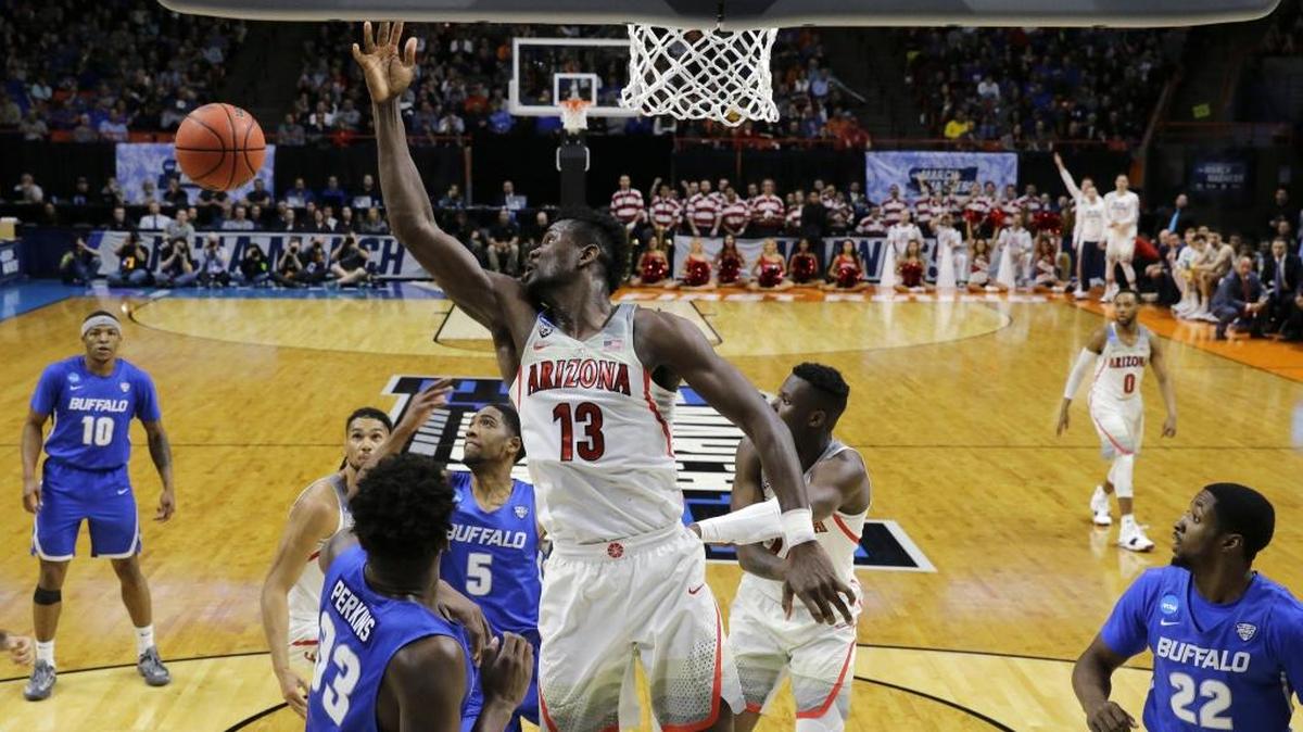 Arizona’s Deandre Ayton (13), the favorite to be the No. 1 overall pick in the NBA draft, had a first-round exit from the NCAA tournament, thanks in part to Buffalo’s relentless double- and triple-teaming Thursday night in Boise, Idaho.