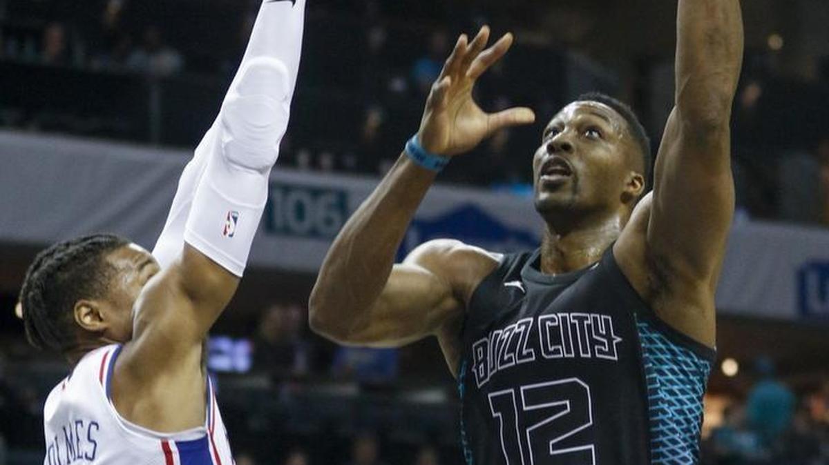 Charlotte Hornets center Dwight Howard, right, has been durable and productive this season. But has he impacted this team’s bottom line?