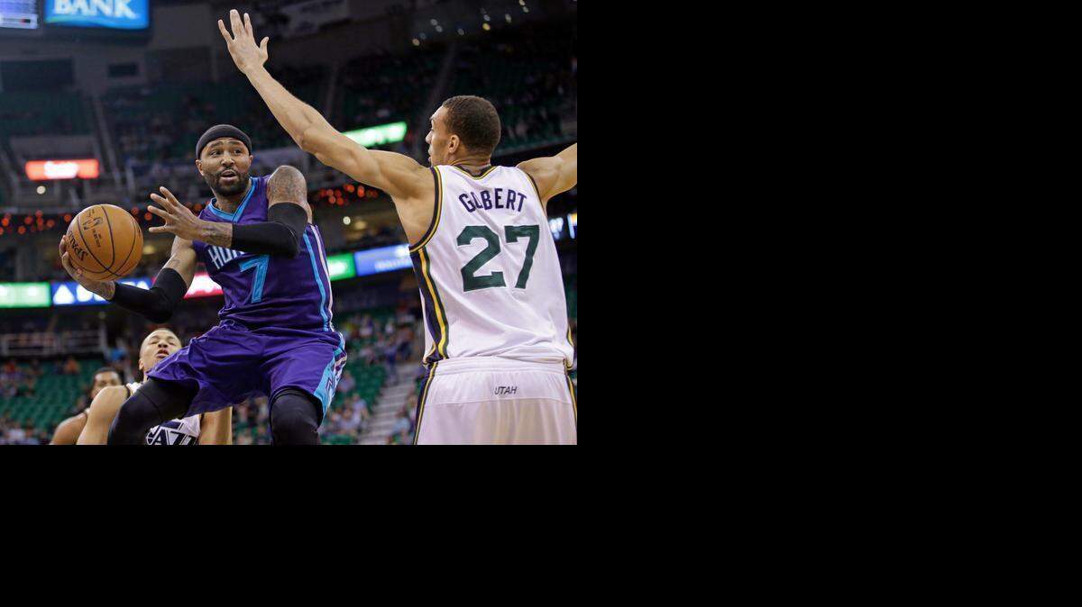 
Charlotte Hornets guard Mo Williams passes the ball as Utah Jazz center Rudy Gobert defends. 
