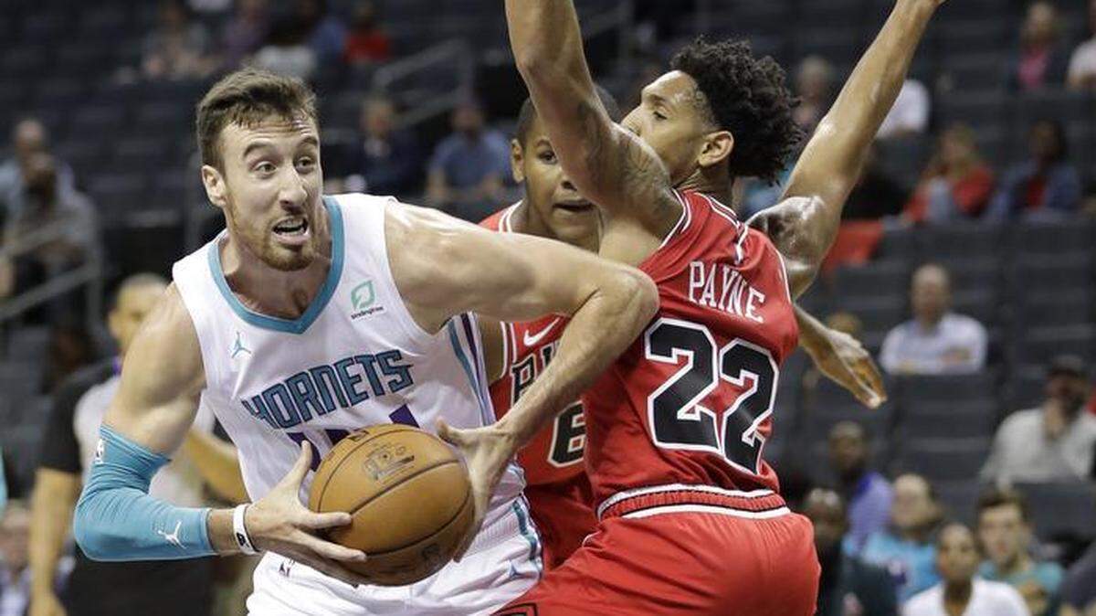 Former ninth overall pick Frank Kaminsky, left, didn’t play for the Charlotte Hornets in Monday’s preseason exhibition against Chicago until the fourth quarter. Here, he drives against the Bulls’ Cameron Payne.