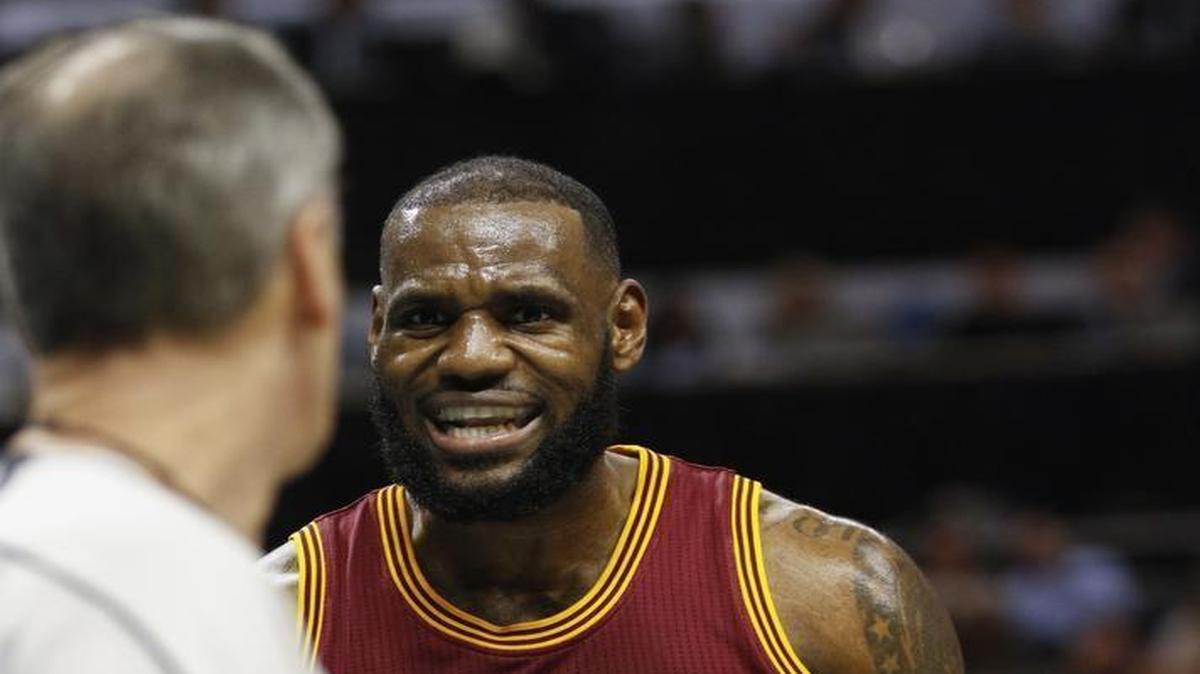 Cleveland Cavaliers forward LeBron James argues with an official during Saturday’s game against the Charlotte Hornets at Spectrum Center.
