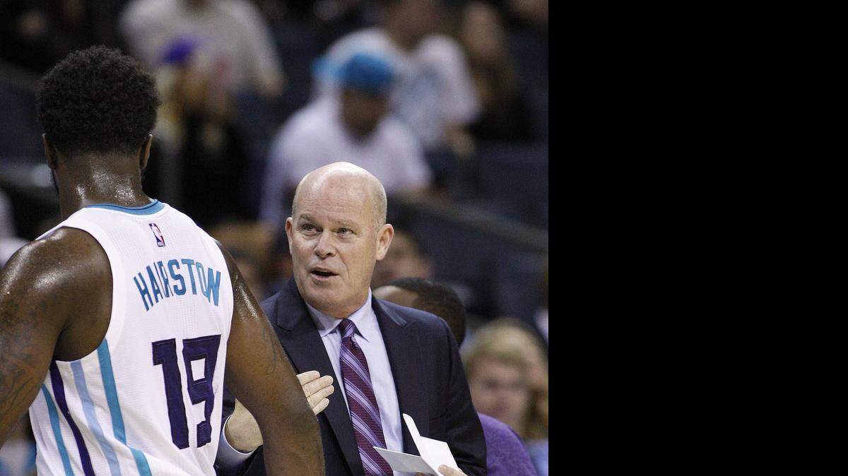 
Charlotte Hornets coach Steve Clifford (right) says guard P.J. Hairston (19) isn’t a “deadeye” shooter, but teams can’t afford to leave him alone outside the 3-point arc.
