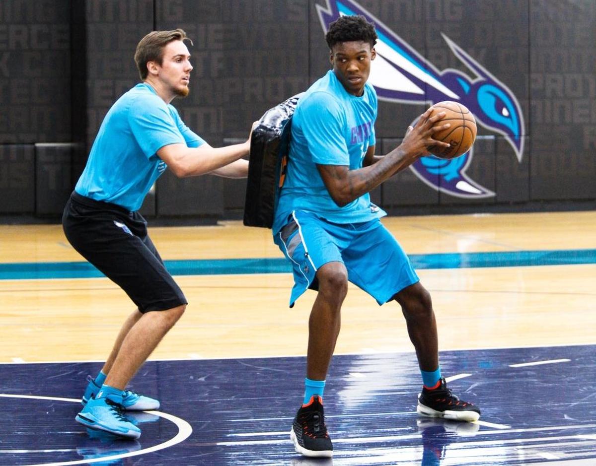 Texas A&M sophomore big man Robert Williams (right), who worked out with the Charlotte Hornets on Saturday at the Spectrum Center, could be a candidate for the Hornets’ 11 th overall pick in the June 21 NBA draft.