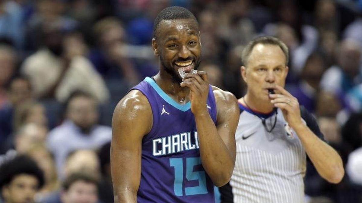 Will Charlotte Hornets coach Steve Clifford (left) have to play All-Star point guard Kemba Walker (15) marathon minutes if the team is in playoff contention in April? It’s happened before.
