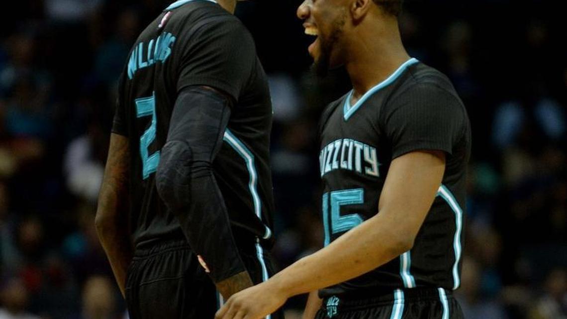 Charlotte Hornets Marvin Williams, left, and Kemba Walker celebrate a basket by Williams during Friday's game against the Philadelphia 76ers game at Time Warner Cable Arena.