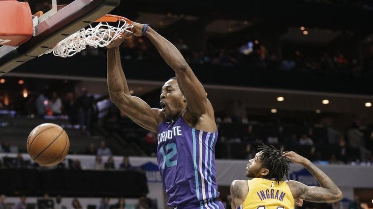One of three first-half dunks for Charlotte Hornets center Dwight Howard during the first half of Saturday’s home game against the Los Angeles Lakers.