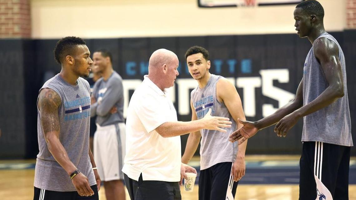 Charlotte Hornets coach Steve Clifford, center, greets 7-foot-1 Thon Maker Friday during the team’s pre-draft workout at Time Warner Cable Arena.
