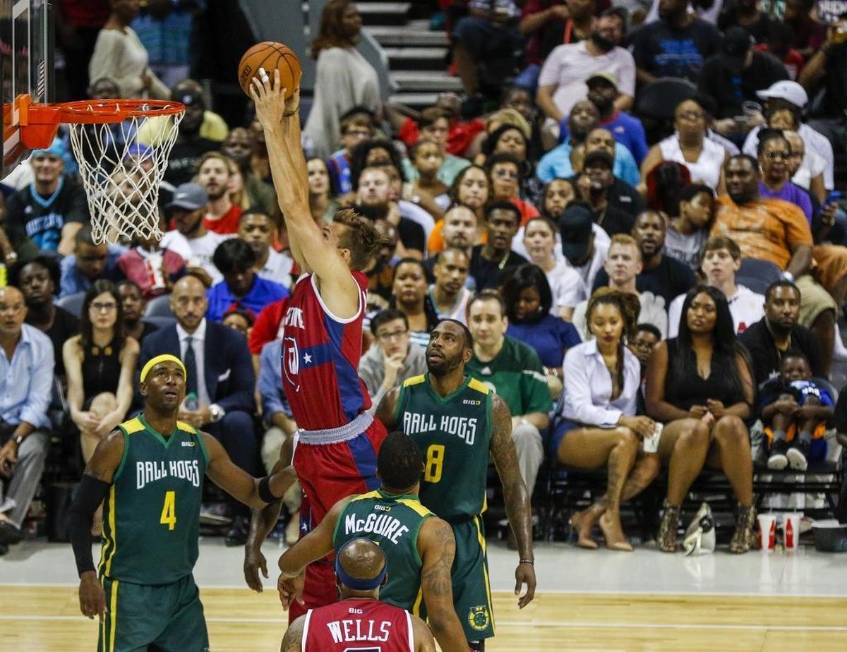 Tri-State's Lou Amundson dunks as Ball Hogs players Derrick Byars (4) and Rasual Butler (8) watch in a game during Sunday’s Big 3 basketball tournament at the Spectrum Center.