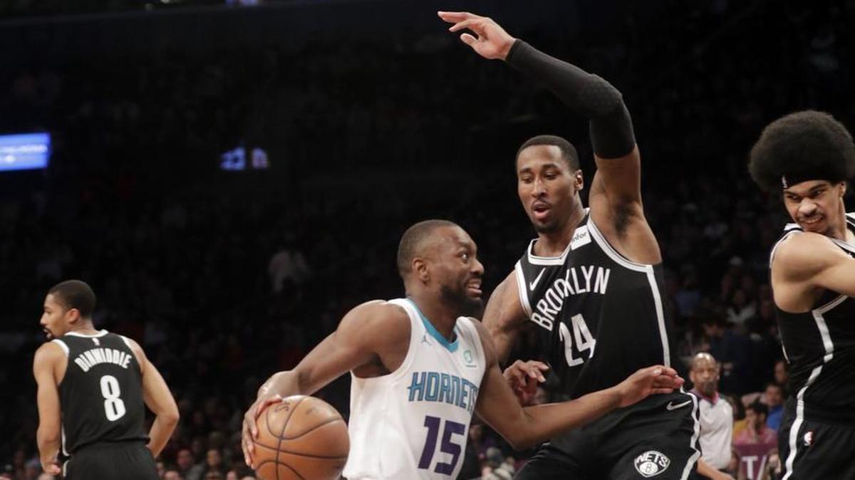 Charlotte Hornets guard Kemba Walker (15) drives to the basket against the Brooklyn Nets' Rondae Hollis-Jefferson during Wednesday night’s NBA game in Brooklyn, N.Y.