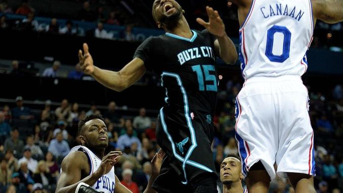 Charlotte Hornets point guard Kemba Walker (15) is stripped of the ball as he goes up for a layup against Philadelphia’s Isaiah Canaan in Friday’s game. Walker still finished with a game-high 27 points and a game-high 11 rebounds, nine of them defensive.