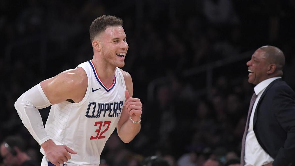 Los Angeles Clippers forward Blake Griffin, left, shares a laugh with coach Doc Rivers Friday in a game against the Lakers.