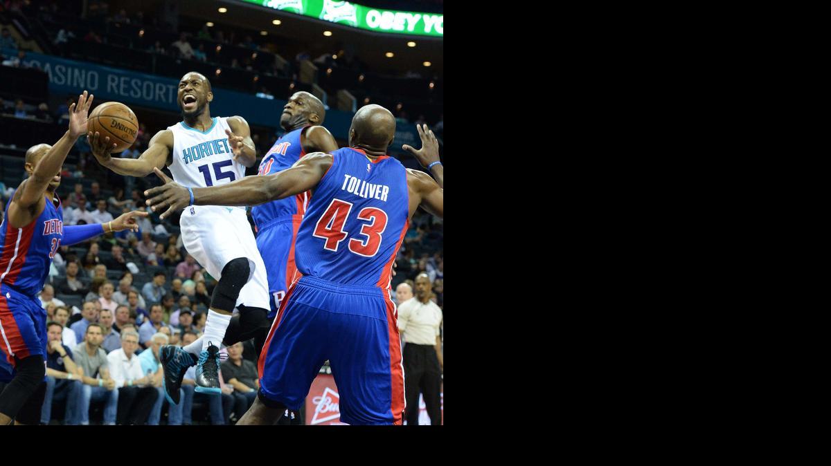 
Charlotte Hornets guard Kemba Walker carries the ball to the basket to score against the Detroit Pistons during Wednesday night's game at Time Warner Cable Arena, April 01, 2015. The Charlotte Hornets won 102-78.
