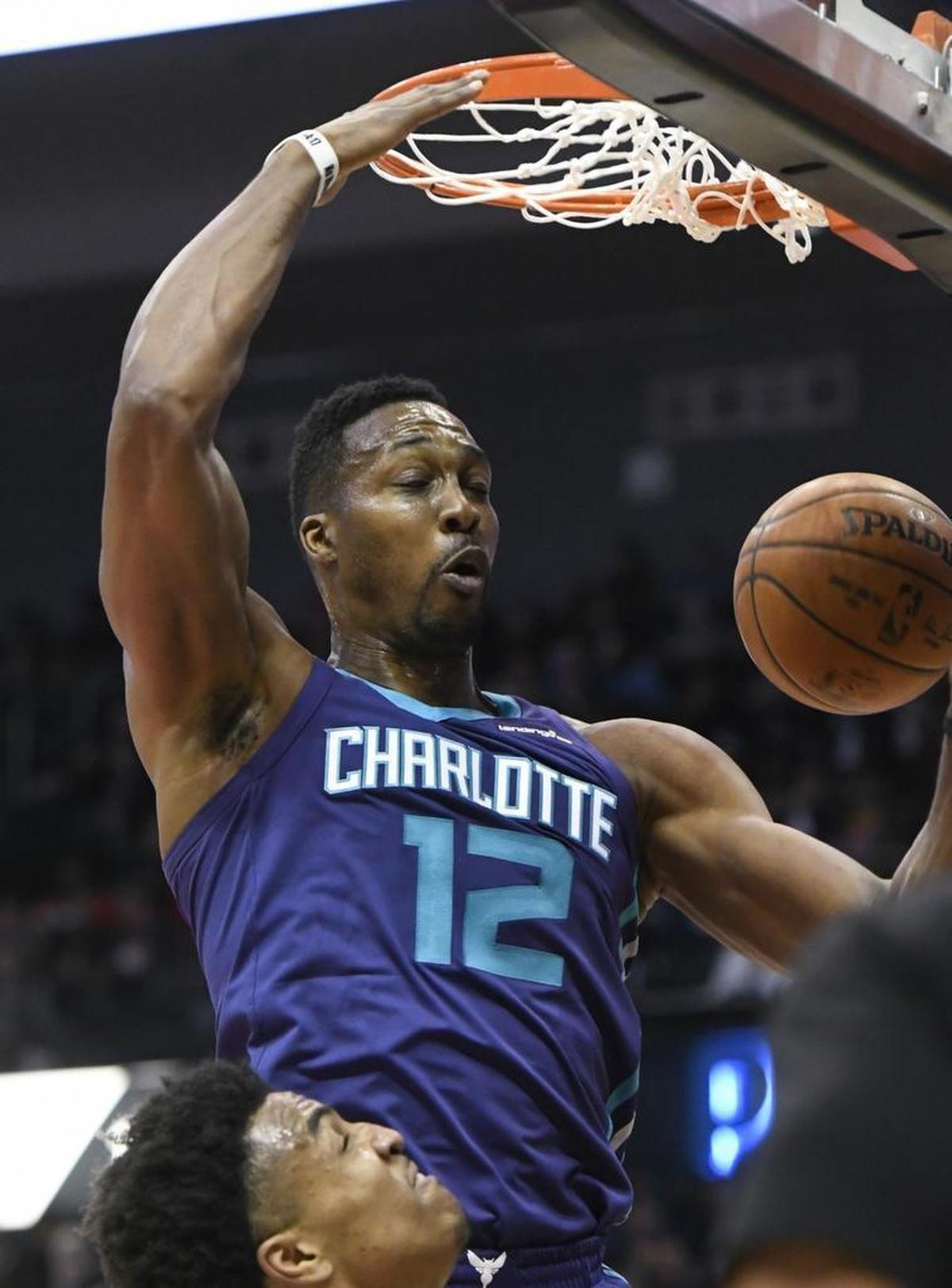 Charlotte Hornets center Dwight Howard dunks against the Atlanta Hawks during the second half of Thursday’s game. Howard scored 33 points with 12 rebounds, both game highs, against his old team as Charlotte won 129-117.