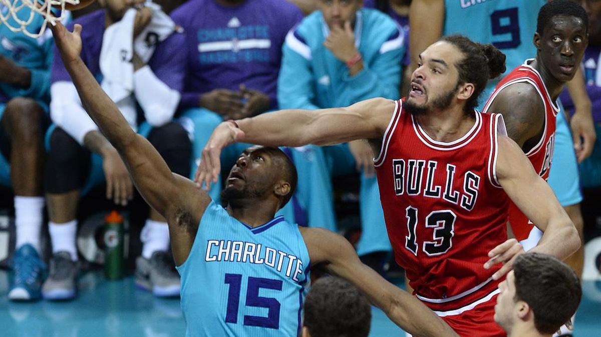 
Charlotte Hornets guard Kemba Walker (15) drives to the basket as Chicago Bulls center/forward Joakim Noah (13) defends during a March 13 game at Time Warner Cable Arena in Charlotte. The Bulls visit Charlotte for a preseason game on Oct. 19. 
