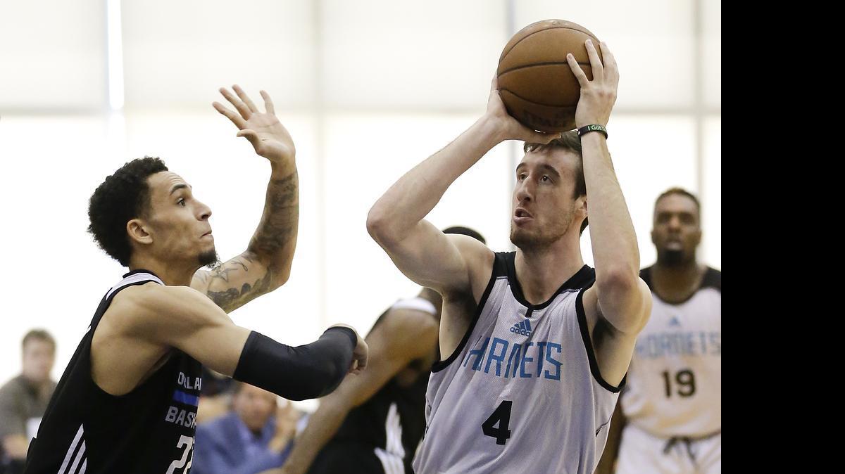 
Charlotte Hornets rookie Frank Kaminsky, right in this photo from Wednesday’s game against Orlando, closed out a five-game NBA summer league stint averaging 15.2 points and 7.8 rebounds per game, NBA.com reported. 


