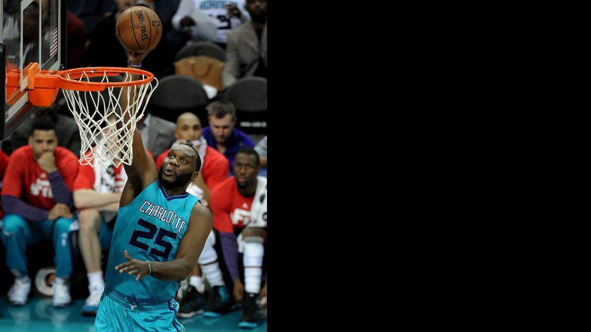 
Charlotte Hornets center Al Jefferson (25) lays the ball in for two points  against the Miami Heat on Jan. 21, 2015 at Time Warner Cable Arena in Charlotte.
