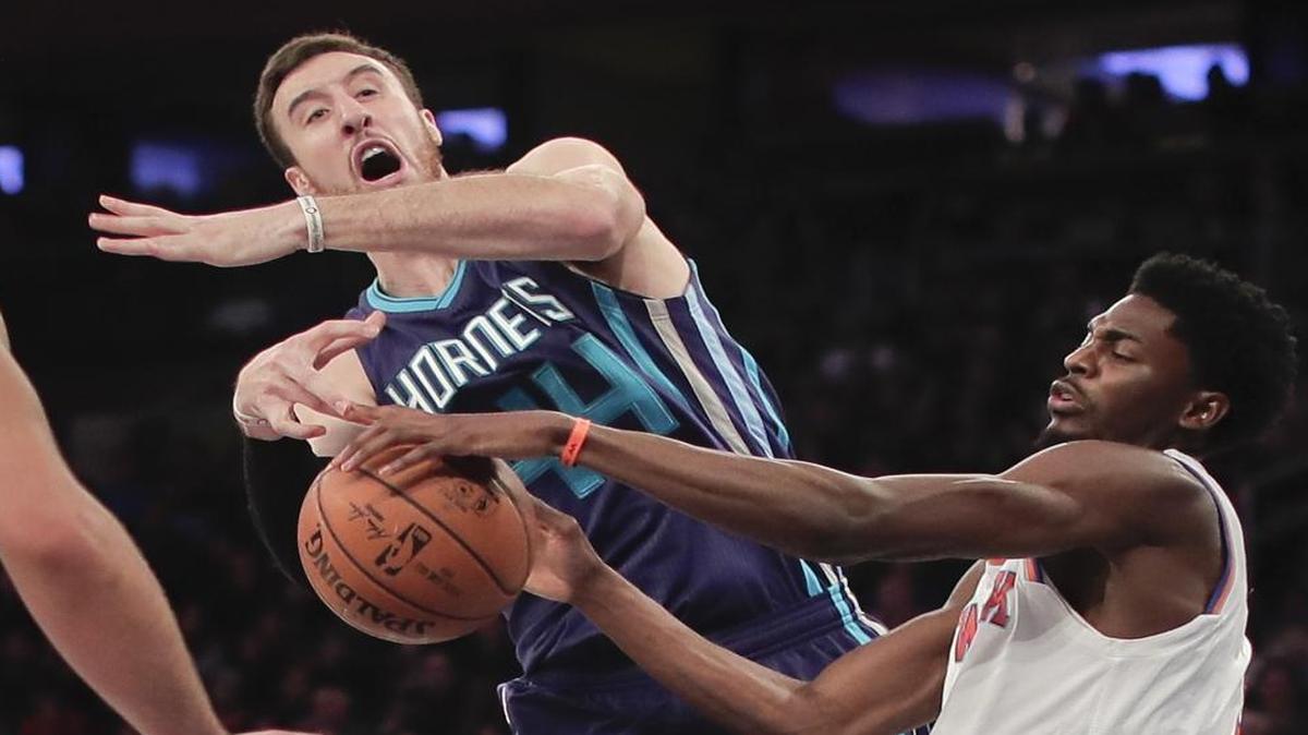 New York Knicks guard Justin Holiday, right, strips the ball from Charlotte Hornets center Frank Kaminsky III (44) during the second quarter of Friday’s game in New York.