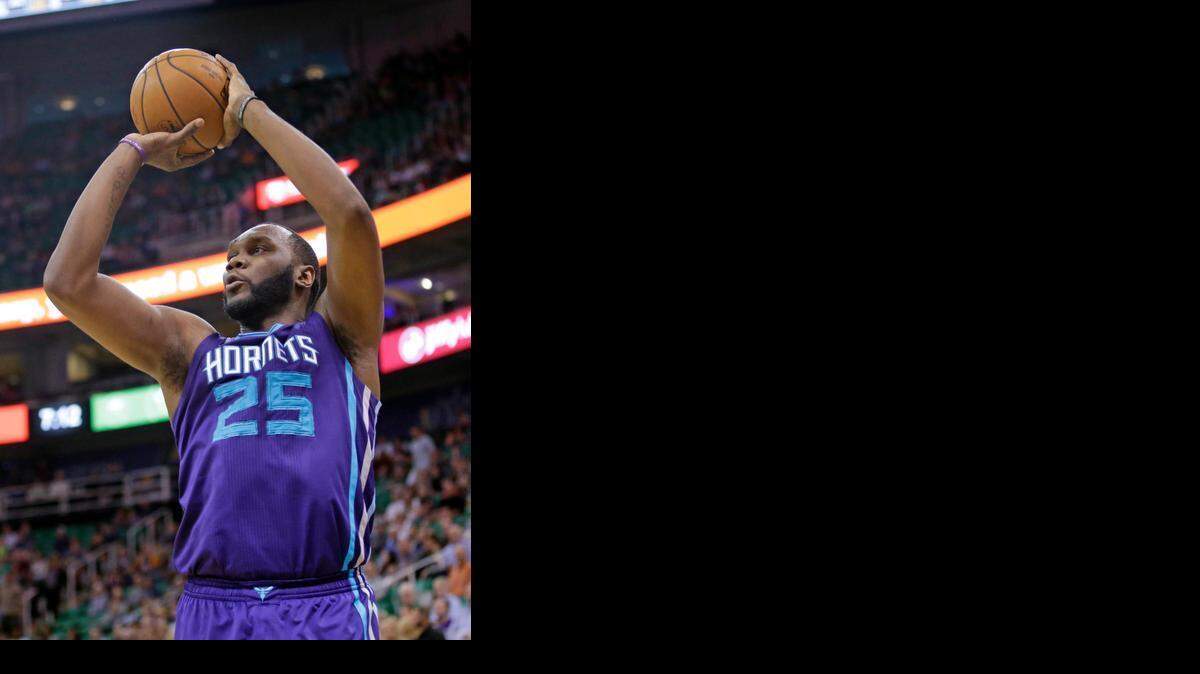 
Charlotte Hornets center Al Jefferson shoots against the Utah Jazz in the first quarter in an NBA basketball game Monday, March 16, 2015, in Salt Lake City. 
