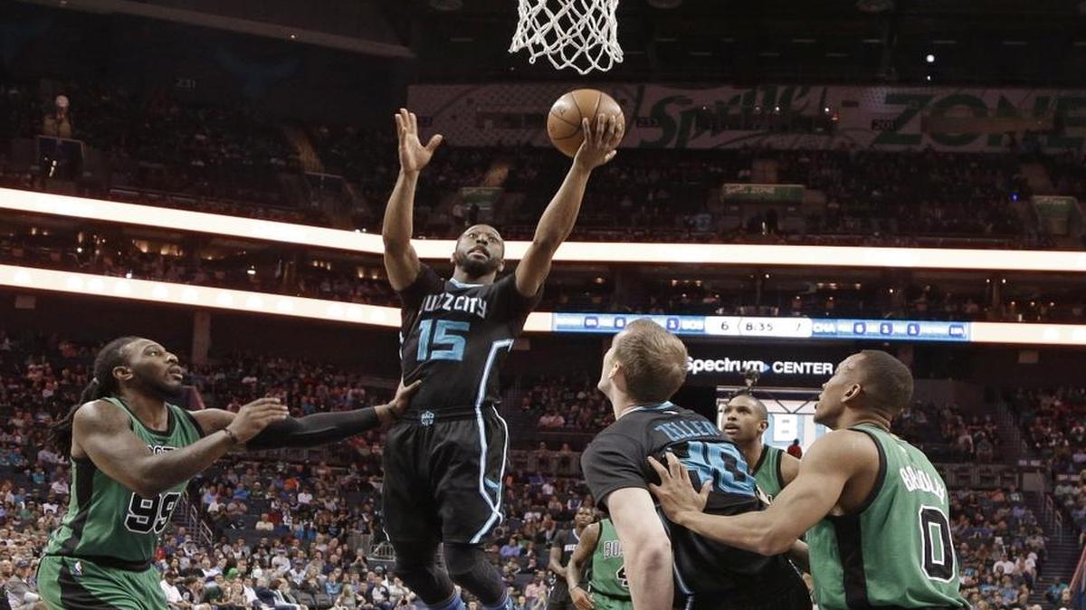 Charlotte Hornets guard Kemba Walker drives against the Boston Celtics’ Jae Crowder (99) during the first half of Saturday’s game in Charlotte.