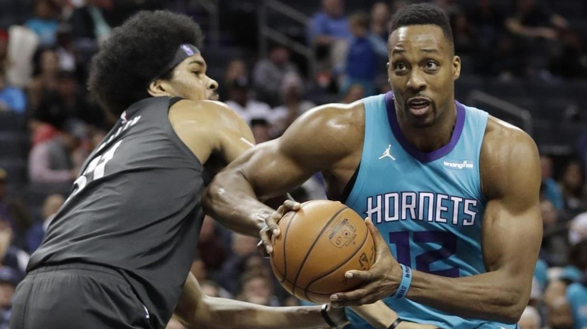 The Charlotte Hornets plan to trade Dwight Howard (right) to the Brooklyn Nets. The Nets reportedly are looking into a buyout of the remaining season on Howard's contract.