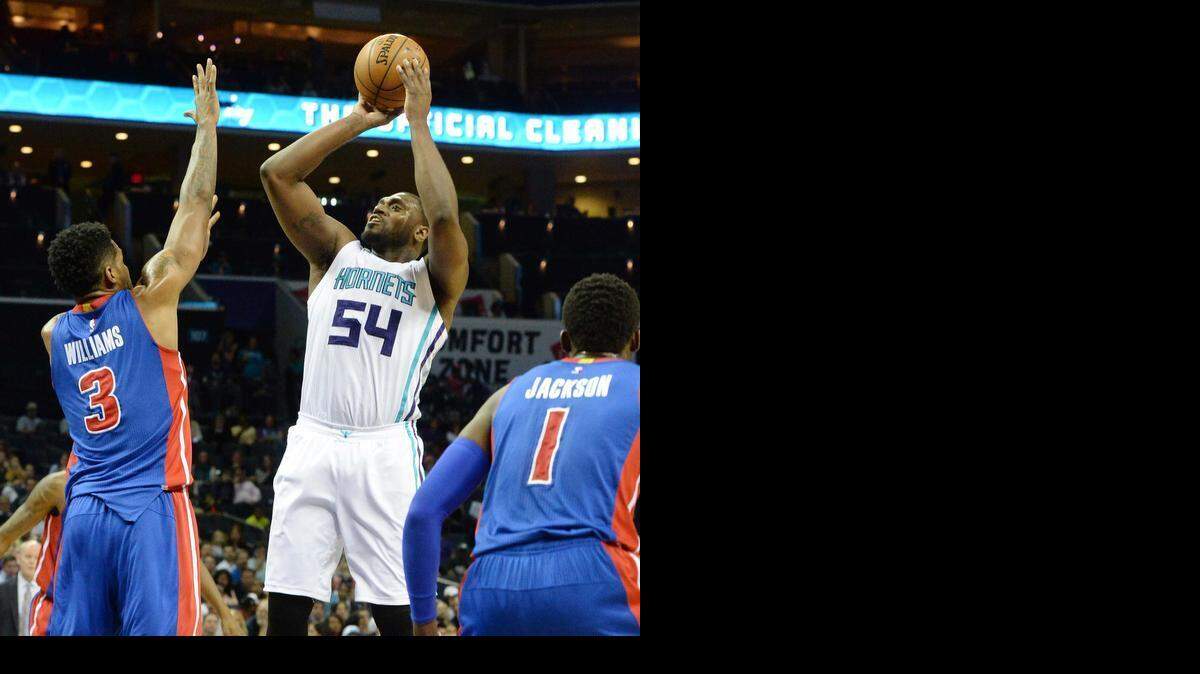 
Charlotte Hornets forward Jason Maxiell, right, shoots over Detroit Pistons Shawne Williams during Wednesday night's game at Time Warner Cable Arena, April 01, 2015.
