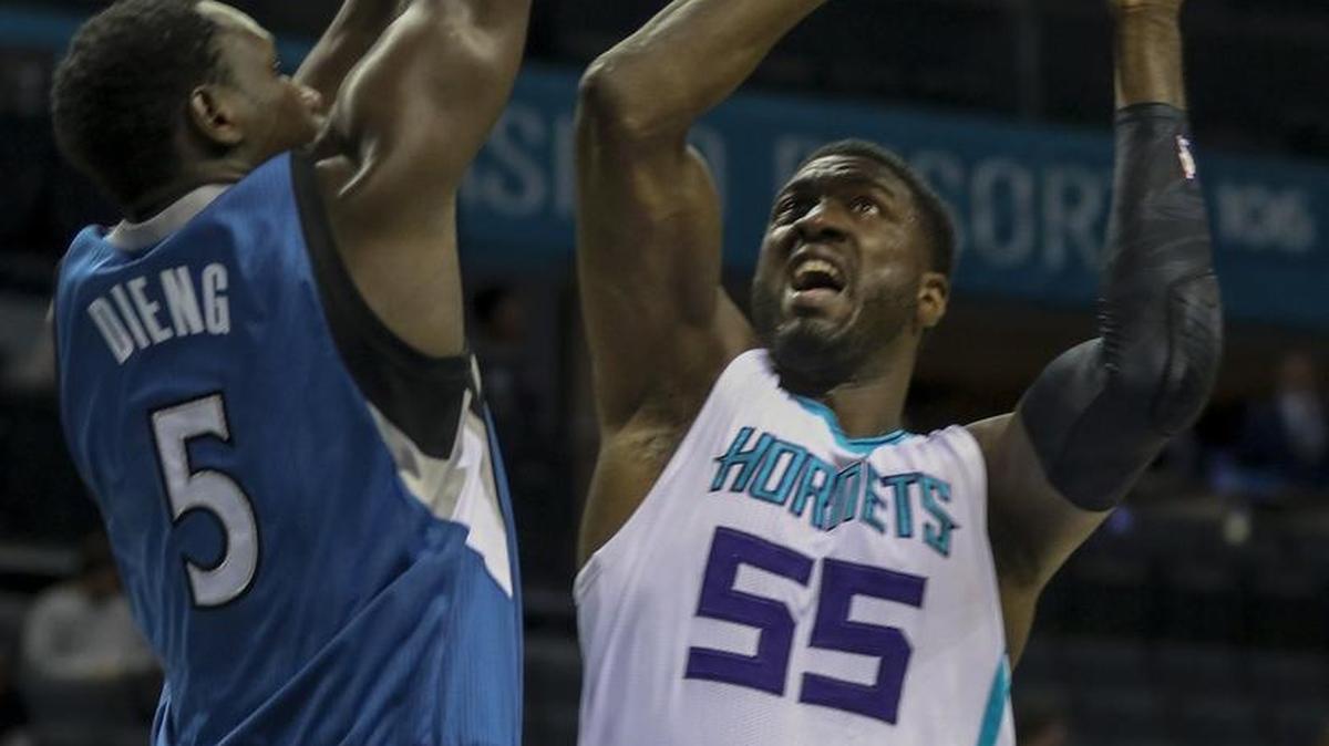 Hornets center Roy Hibbert shoots against Minnesota Timberwolves forward Gorgui Dieng during the first half of Monday night’s exhibition in Charlotte.
