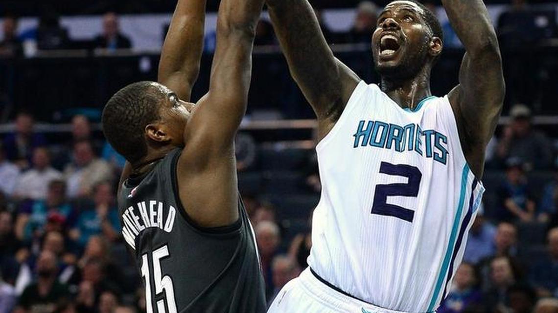 Charlotte Hornets forward Marvin Williams puts up a shot over Brooklyn Nets guard Isaiah Whitehead during the first half Tuesday night at the Spectrum Center in Charlotte.