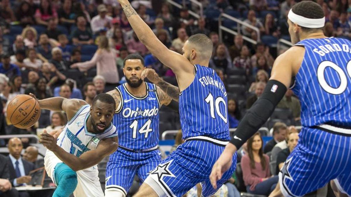 The Orlando Magic held Charlotte Hornets leading scorer Kemba Walker, left, to 10 points on 4-of-20 shooting Thursday night. Orlando won 127-89 for its fifth straight game and ended a 13-game losing streak to the Hornets.