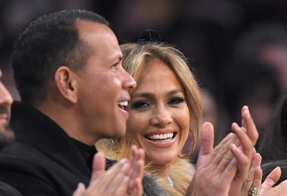 Alex Rodriguez, left, and Jennifer Lopez watch during the first half of Friday’s game between the Los Angeles Lakers and the Charlotte Hornets.