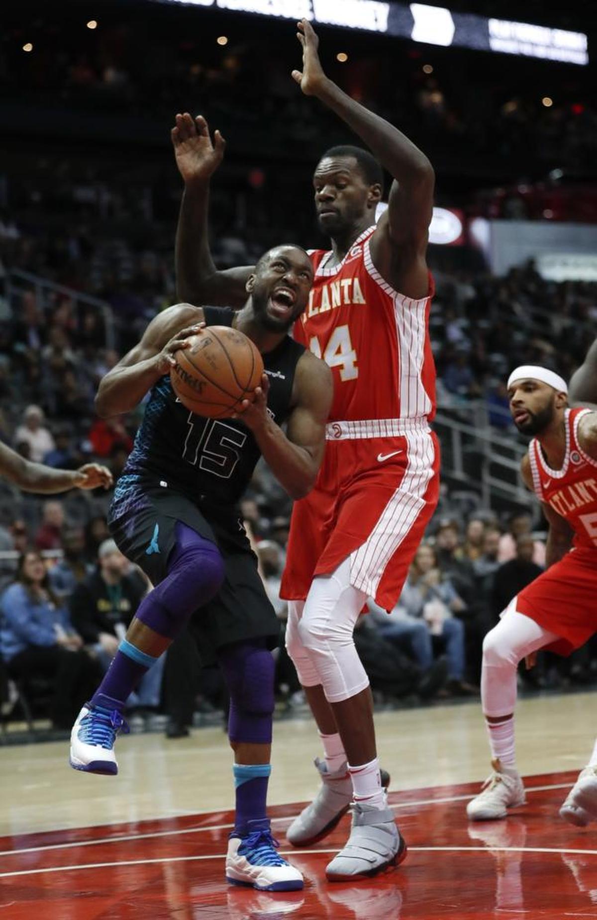 Two opposing coaches, the New Orleans Pelicans’ Alvin Gentry and the Hawks’ Mike Budenholzer, have both said that Kemba Walker, left, is among the most competitive players in all the NBA.