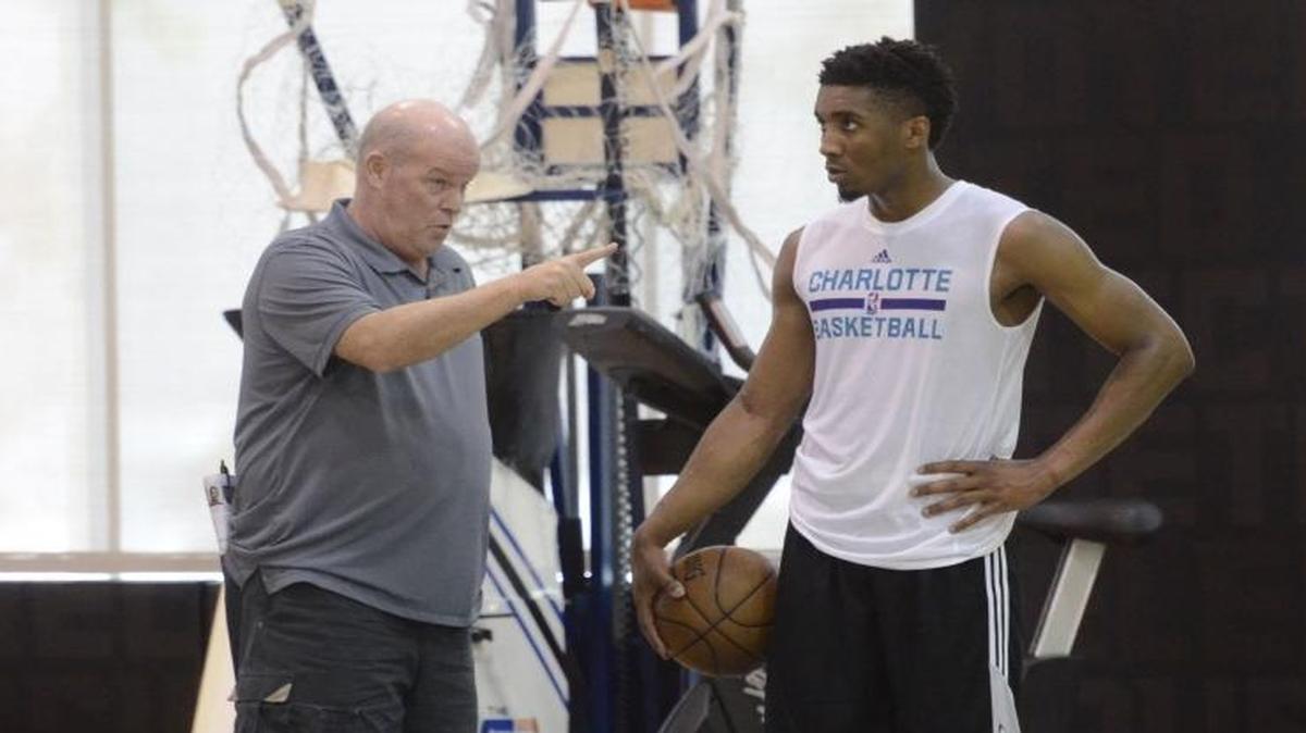 Charlotte Hornets head coach Steve Clifford speaks to former Louisville guard Donovan Mitchell after a pre-draft workout on Monday at the Spectrum Center. There were six prospects worked out on Monday including Mitchell and former Adelaide 36ers guard Terrance Ferguson. Photos were made at Spectrum Center on June 12, 2017.