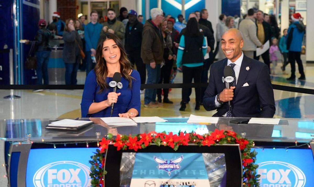 Ashley ShahAhmadi and former Charlotte Hornet Gerald Henderson in the Fox Sports Southeast broadcast booth at Spectrum Center on Dec. 19, her first night in her new expanded role.