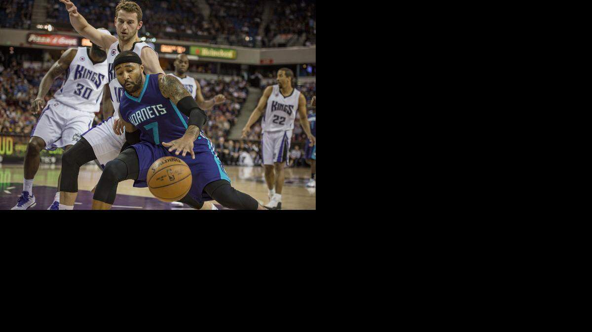 
The Charlotte Hornets' Mo Williams (7) drives against the Sacramento Kings' Nik Stauskas (10) in the second quarter at Sleep Train Arena in Sacramento, Calif., on Friday, March 20, 2015. 
