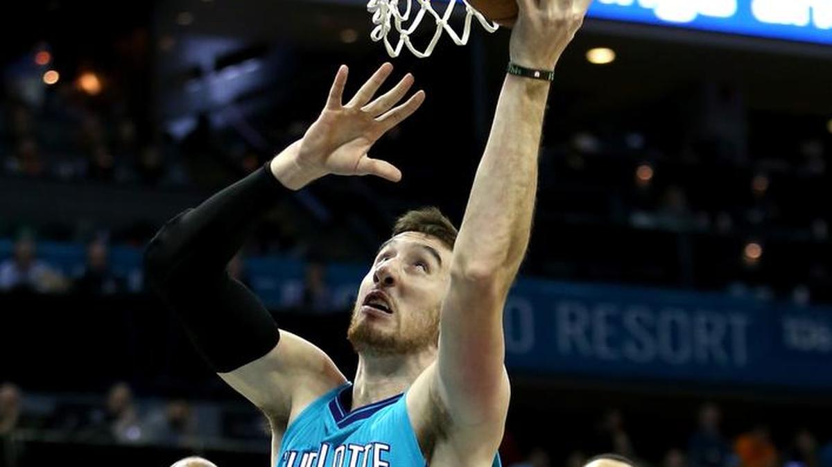 CHARLOTTE, NC - JANUARY 16: Frank Kaminsky #44 of the Charlotte Hornets goes to the basket as teammates Khris Middleton #22 and John Henson #31 of the Milwaukee Bucks watch on during their game at Time Warner Cable Arena on January 16, 2016 in Charlotte, North Carolina. NOTE TO USER: User expressly acknowledges and agrees that, by downloading and or using this photograph, User is consenting to the terms and conditions of the Getty Images License Agreement. (Photo by Streeter Lecka/Getty Images)