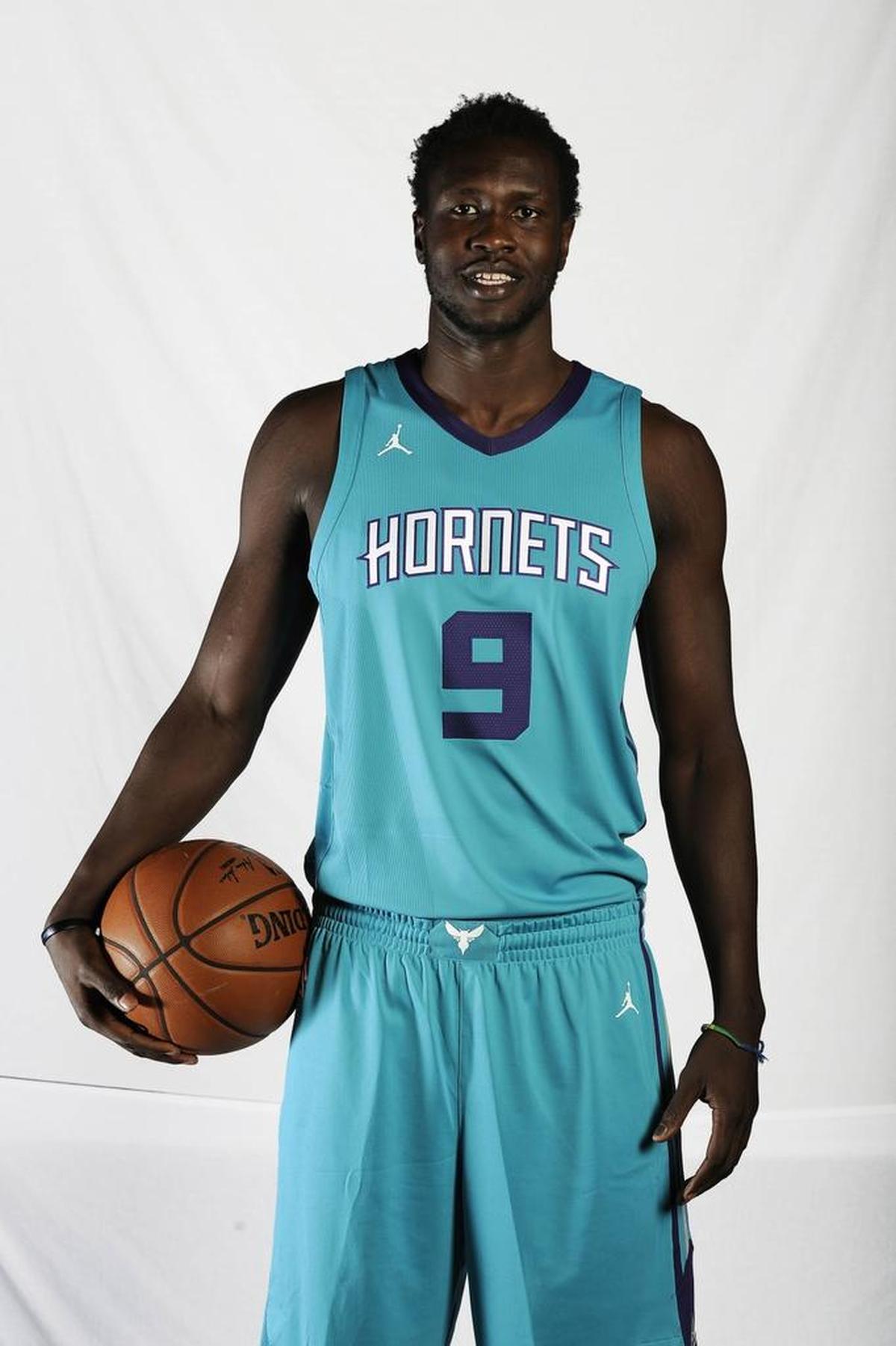 Charlotte Hornets Mangok Mathiang poses for a portrait during the team's media day at the Spectrum Center on Monday.
