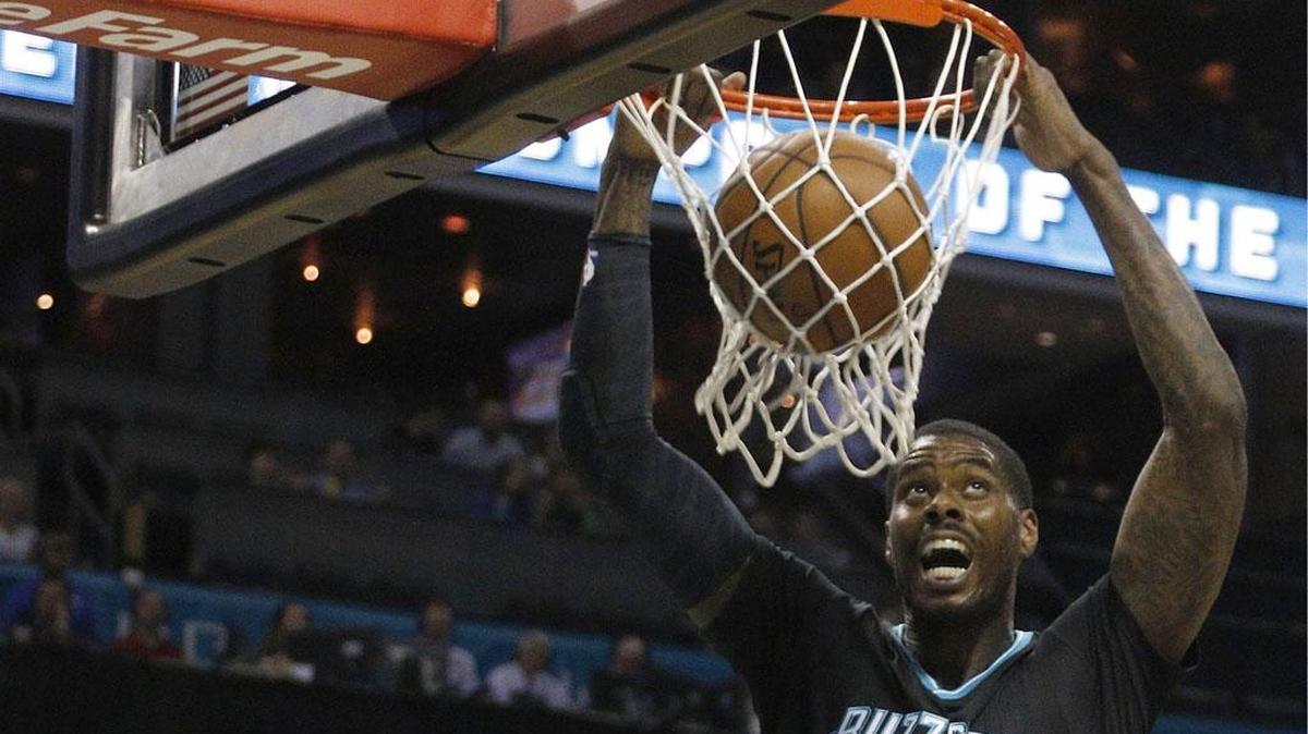 Charlotte Hornets' Marvin Williams (2) gets free for a dunk against the Houston Rockets during Saturday’s game in Charlotte.