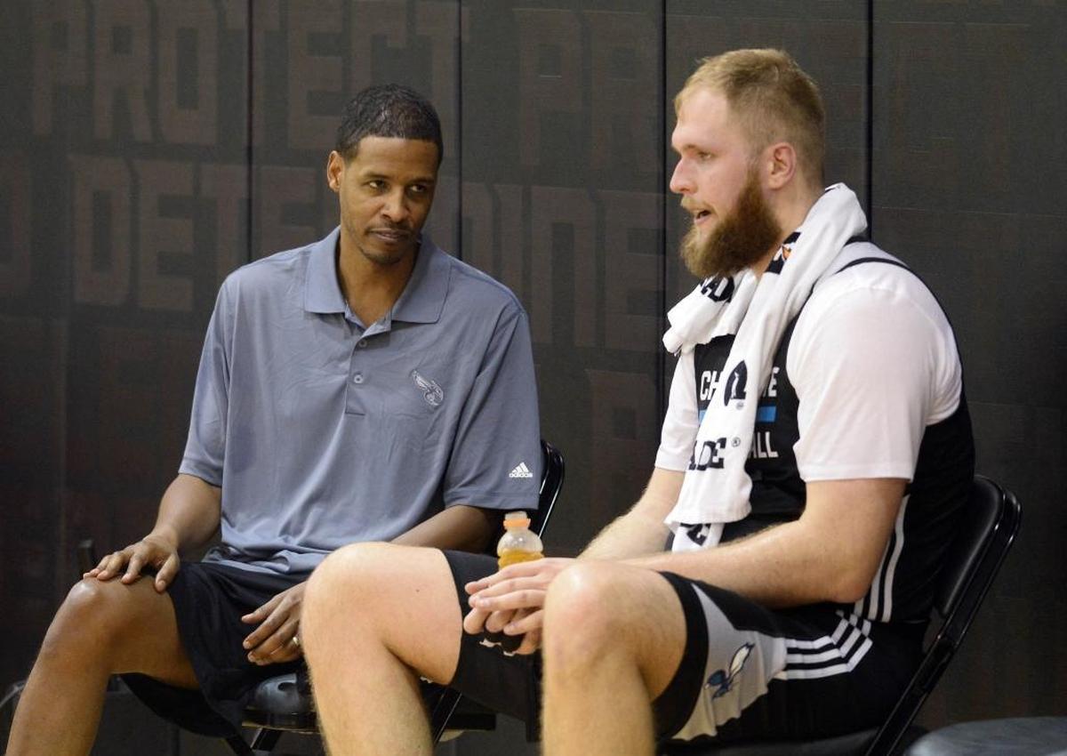 Charlotte Hornets assistant Stephen Silas, left, saw some nuances he liked in Przemek Karnowski’s play in practice.