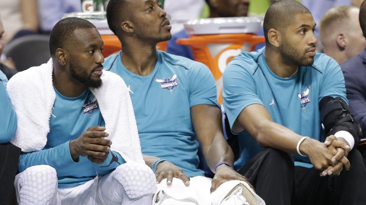 Charlotte Hornets guard Nic Batum (right with brace on left elbow) believes he’ll be cleared to practice in the next 10 days and be playing again on two to three weeks.