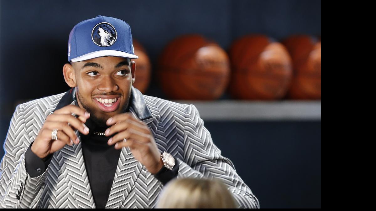 
Karl-Anthony Towns reacts after being selected first overall by the Minnesota Timberwolves during the NBA basketball draft, Thursday, June 25, 2015, in New York.
